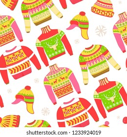 Knitted sweaters and warm winter hat seamless pattern