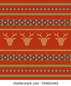 Knitted texture on red background with deers
