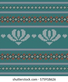 Knitted  texture on turquoise background with flowers. Colorful striped pattern. Sample can be used as scheme of knitting, wallpaper, design element, independent project, etc. Woolen cloth, handmade.