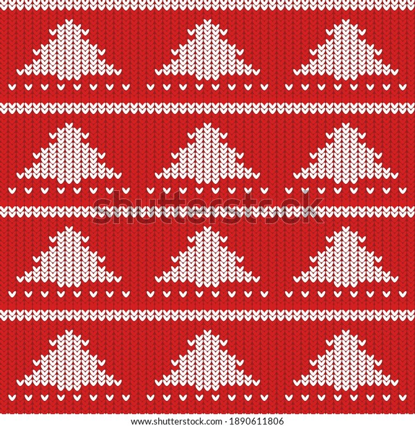 knitted texture of red color with a white pattern\
in the form of Christmas\
trees