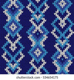 Knitted  winter motif background in various cool blue hues and in white color, seamless knitting vector pattern as a fabric texture