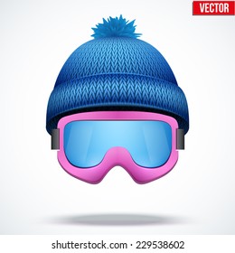 Knitted woolen blue cap with snow ski goggles. Winter seasonal sport hat. Vector illustration isolated on white background.