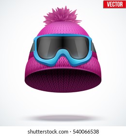 Knitted woolen cap with snow ski goggles. Winter seasonal sport hat. Vector illustration isolated on white background.