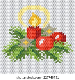 Knitting background with christmas candle and pine branches