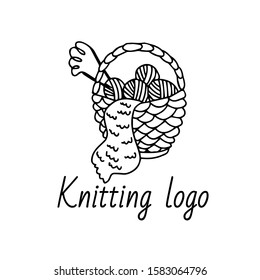 Knitting logo template. A nice wicker basket with clews and knitting needles. Knitting hobby in doodle sketch isolated outline. Hand drawn vector illustration in black ink on white background. 