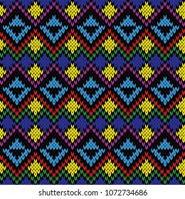 Knitting multicolour motley ethnic background in red, yellow, green, purple and blue colours, seamless knitting vector pattern as a fabric texture