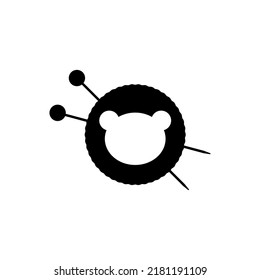 Knitting needles and ball of thread with plush toy illustration. Simple minimal logo design. Vector illustration on white background.