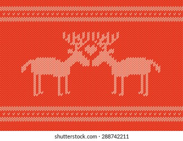Knitting red and white sweater with a pair of deer in love.