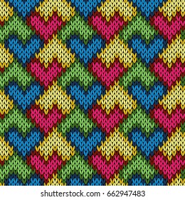Knitting seamless variegated vector pattern as a fabric texture with stylized hearts in orange, blue, yellow, red, pink and green colors