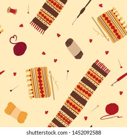 Knitting woolen scarves, seamless pattern. Winter knitwear with folk ornaments. Handcraft tools, crochets, pins, yarn balls, thread spools. 