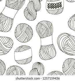 Knitting yarn balls seamless pattern in hand drawn style. For print, textile and creative design. Vector illustration. 