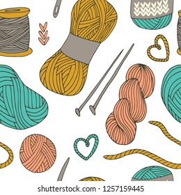 Knitting yarn balls seamless pattern in hand drawn style. For print, textile and creative design. Vector illustration. 