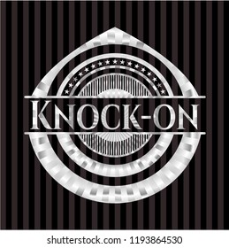 Knock-on silvery emblem