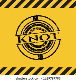 Knot black grunge emblem with yellow background. Vector Illustration. Detailed.