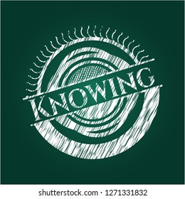 Knowing chalkboard emblem on black board