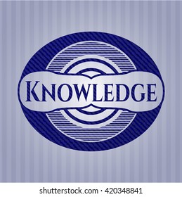 Knowledge badge with denim background