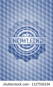 Knowledge blue badge with geometric pattern background.