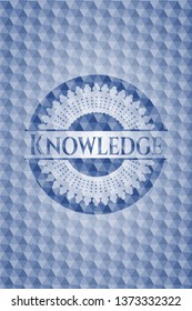 Knowledge blue emblem or badge with geometric pattern background.