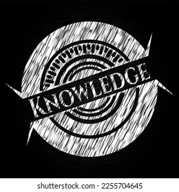 Knowledge chalk emblem written on a blackboard. Vector Illustration. Detailed. 