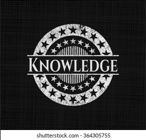 Knowledge chalkboard emblem on black board