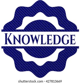 Knowledge emblem with jean background