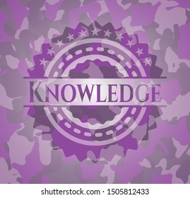 Knowledge pink and purple written on a camouflage texture. Vector Illustration. Detailed.