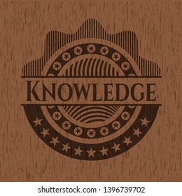 Knowledge realistic wooden emblem. Vector Illustration.