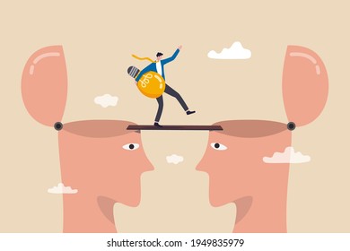 Knowledge transfer or idea sharing between employee or teamwork, skill training or work transition concept, businessman holding idea light bulb walking on the bridge from human head brain to other.