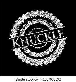 Knuckle written on a blackboard