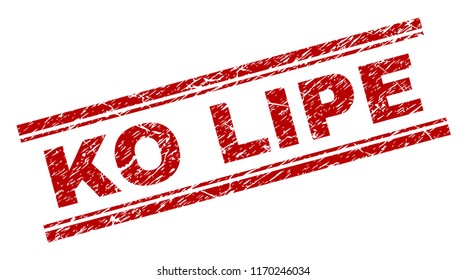KO LIPE seal stamp with corroded texture. Red vector rubber print of KO LIPE text with corroded texture. Text title is placed between double parallel lines.