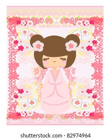 Kokeshi doll on the pink background with floral ornament