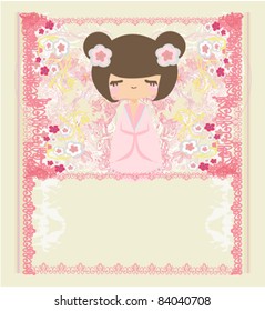 Kokeshi doll on the pink background with floral ornament