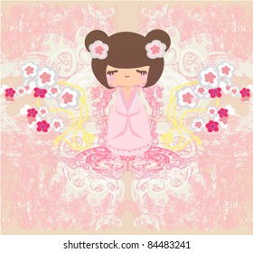 Kokeshi doll on the pink background with floral ornament