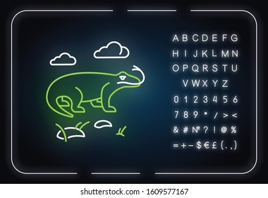 Komodo dragon neon light icon. Tropical country animals. Indonesian fauna. Exploring exotic wildlife. Varans in nature. Glowing sign with alphabet, numbers and symbols. Vector isolated illustration