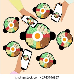 Korea food,holding phone to take a picture of Korea food, in the food consist with mushrooms,tofu,egg,carrot.