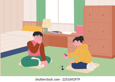 Korean childhood games. Children sitting in the room and playing the five stone game.