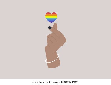 A Korean finger heart gesture, Saint Valentines concept, modern lifestyle and homosexual relationships, LGBTQ rainbow symbol