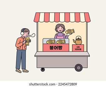 Korean street food. Taiyaki shop and customers.