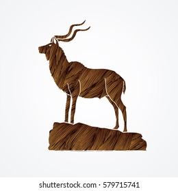 Kudu standing on the cliff designed using brown grunge brush graphic vector.