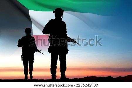 Kuwait flag and the silhouettes of a soldiers on background of sunset. Concept - National, Liberation Days. EPS10 vector