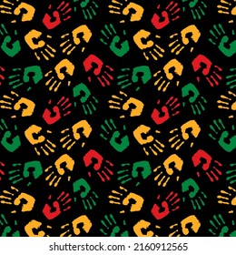 Kwanzaa, Black history month, Juneteenth. Tribal African ethnic seamless pattern with painted hands in red, yellow and green on black background.  Vector traditional textile, paper, fabric. 