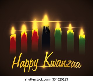 Kwanzaa candles lighted with golden greeting message.