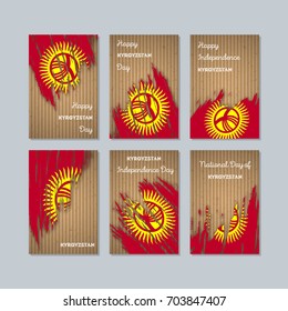 Kyrgyzstan Patriotic Cards for National Day. Expressive Brush Stroke in Flag Colors on kraft paper background. Vector Greeting Card.