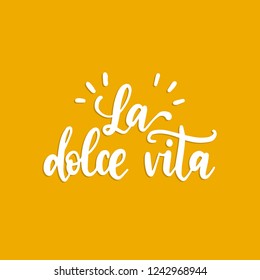 La Dolce Vita translated from Italian The Sweet Life, handwritten phrase. Vector calligraphy of inspirational quote on yellow background.