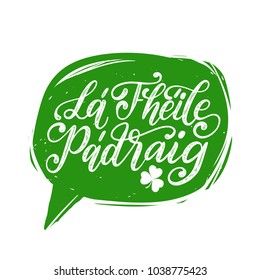 La Fheile Padraig translated from Irish Saint Patrick's Day handwritten phrase for greetings card or poster. Calligraphy in speech bubble. Irish festive vector illustration.