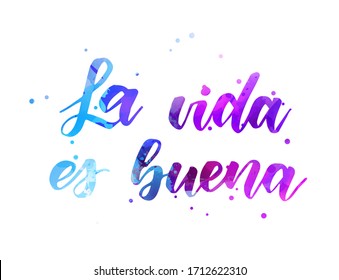 La vida es buena (Life is good in Spanish) - handwritten modern calligraphy watercolor lettering.  Blue and purple colored.