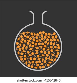 Lab flask filled with orange candies
