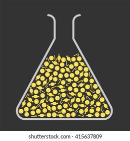 Lab flask filled with yellow candies
