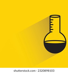 lab flask with shadow on yellow background