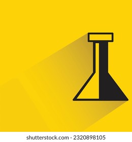 lab flask with shadow on yellow background